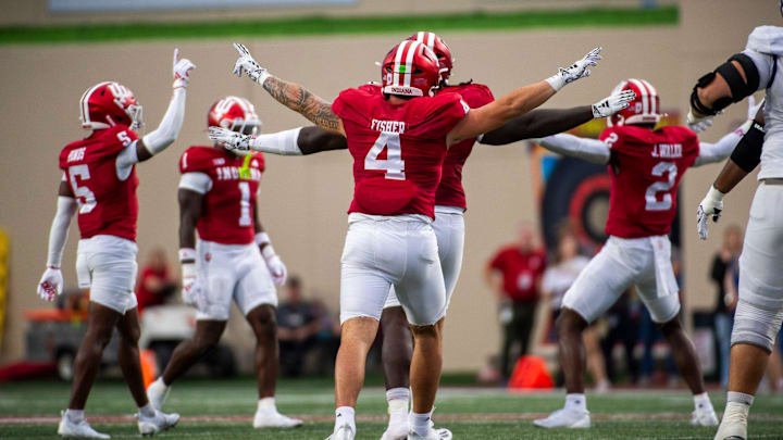 Indiana's Aiden Fisher (4) and the defense celebrateagainst Western Illinois at Memorial Stadium.