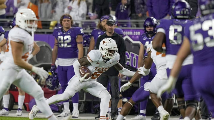 Texas Longhorns defensive back Terrance Brooks (8) tries to run the ball back after a interception against TCU Horned Frogs quarterback Josh Hoover (10) in the second quarter of an NCAA college football game, Saturday, November. 11, 2023, at Amon G. Carter Stadium in Fort Worth, Texas.