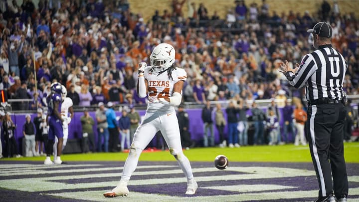 Texas Longhorns running back Jonathon Brooks (24) celebrates after he runs into the end zone for a touchdown against TCU Horned Frogs in the first quarter of an NCAA college football game, Saturday, November. 11, 2023, at Amon G. Carter Stadium in Fort Worth, Texas.