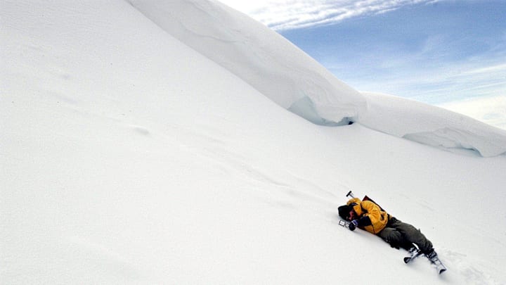 Ski patrol member Scott Cecchi checks the slope angle in a section of the backcountry near Castle Peak on Jan. 9, 2004. Cecchi is directly under the cornice where an avalanche on New Year's Day 2004 killed Drew Gashler. While Cecchi is exactly where you do not want to be during a wind or weather event, several days of melt-freeze conditions solidified the snowpack enough to safely take reading below the cornice.
Ski patrol member Scott Cecchi Castle Peak slope Ski patrol member Scott Cecchi checks the slope angle in a section of the backcountry near Castle Peak on Jan. 9, 2004. Cecchi is directly under the cornice where an avalanche on New Year's Day 2004 killed Drew Gashler. While Cecchi is exactly where you do not want to be during a wind or weather event, several days of melt-freeze conditions solidified the snowpack enough to safely take reading below the cornice.
Ski patrol member Scott Cecchi Castle Peak slope