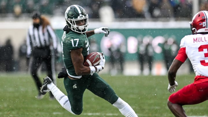 Michigan State's Tre Mosley runs after a catch against Indiana during double overtime on Saturday,