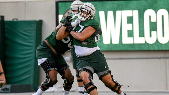 Michigan State's Ethan Boyd, right, runs a drill during the Meet the Spartans open practice on