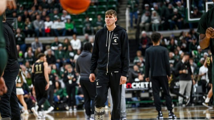 Michigan State's Gehrig Normand looks on wearing a protective boot on his right foot before the game against Oakland on Monday, Dec. 18, 2023, at the Breslin Center in East Lansing.