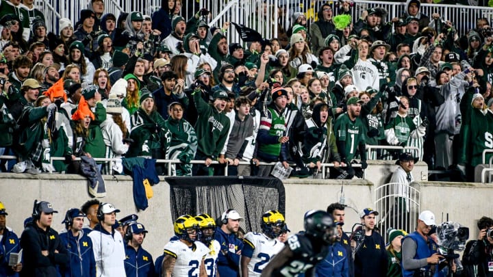 Michigan State's fans cheer behind Michigan's bench during the first quarter on Saturday, Oct. 21, 2023, at Spartan Stadium in East Lansing.