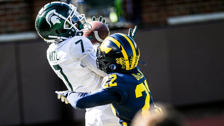 Michigan State's Ricky White, left, catches a touchdown as Michigan's Gemon Green defends during the first quarter on Saturday, Oct. 31, 2020, at Michigan Stadium in Ann Arbor.

201031 Msu Um 046a