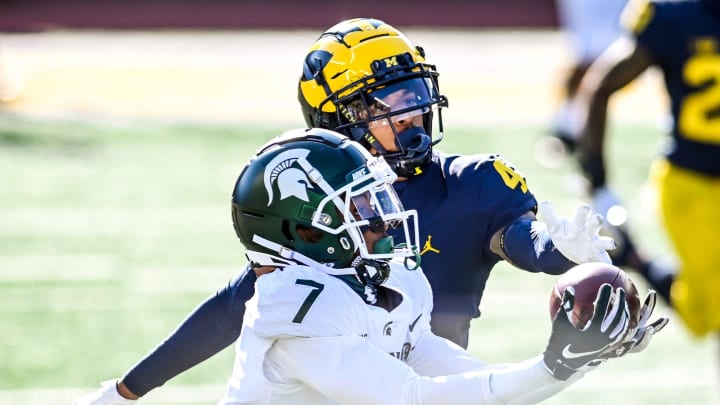 Michigan State's Ricky White, left, catches a pass as Michigan's Vincent Gray defends during the third quarter on Saturday, Oct. 31, 2020, at Michigan Stadium in Ann Arbor.

201031 Msu Um 132a