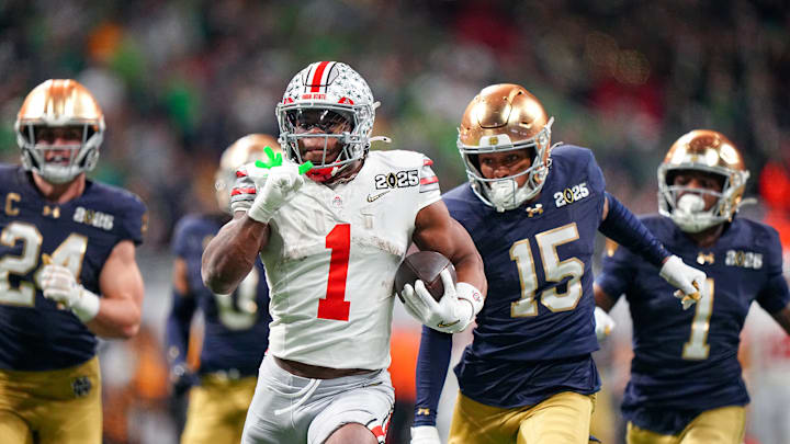 Ohio State running back Quinshon Judkins sprints past Notre Dame defenders at the 2025 College Football Playoff national championship game.