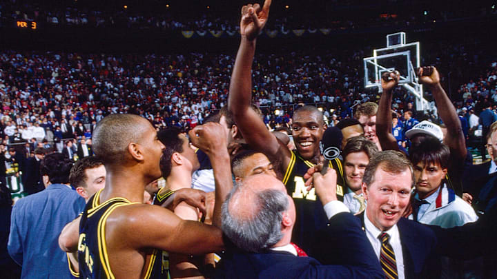 Michigan interim coach Steve Fisher and the Wolverines players celebrate after winning the 1989 NCAA men’s basketball national championship. Michigan interim coach Steve Fisher and the Wolverines players celebrate after winning the 1989 NCAA men’s basketball national championship.