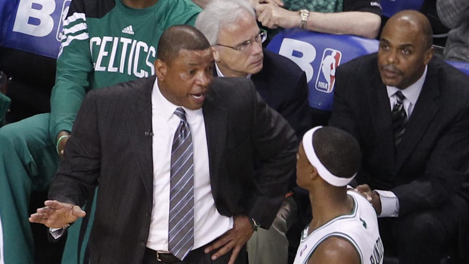 Boston Celtics head coach Doc Rivers talks with point guard Rajon Rondo in a game against the Miami Heat.