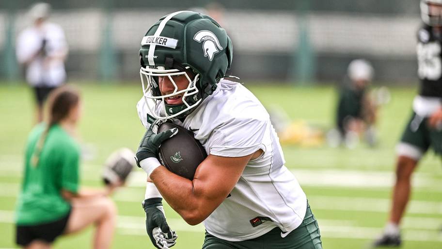 Michigan State tight end Carson Gulker runs after a catch during football practice.