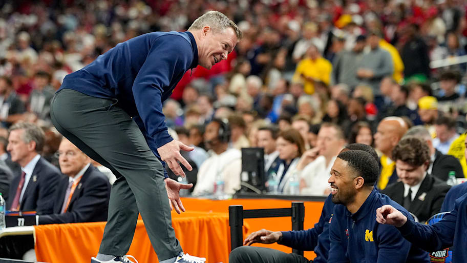 Michigan Wolverines coach Dusty May talks to the Michigan bench during a Final Four win over Arizona.