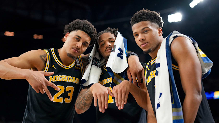 Michigan Wolverines celebrate their Final Four win over Arizona.