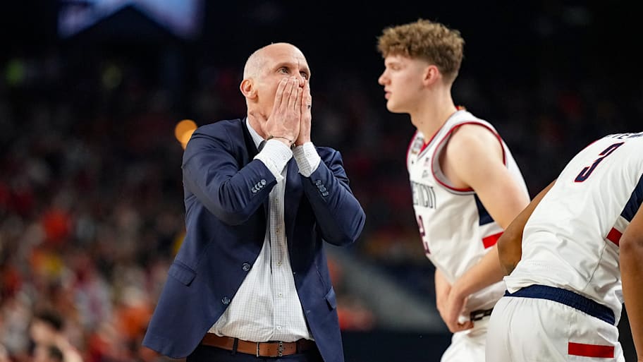 UConn Huskies coach Dan Hurley covers his mouth in exasperation after a play against Illinois in the Final Four.