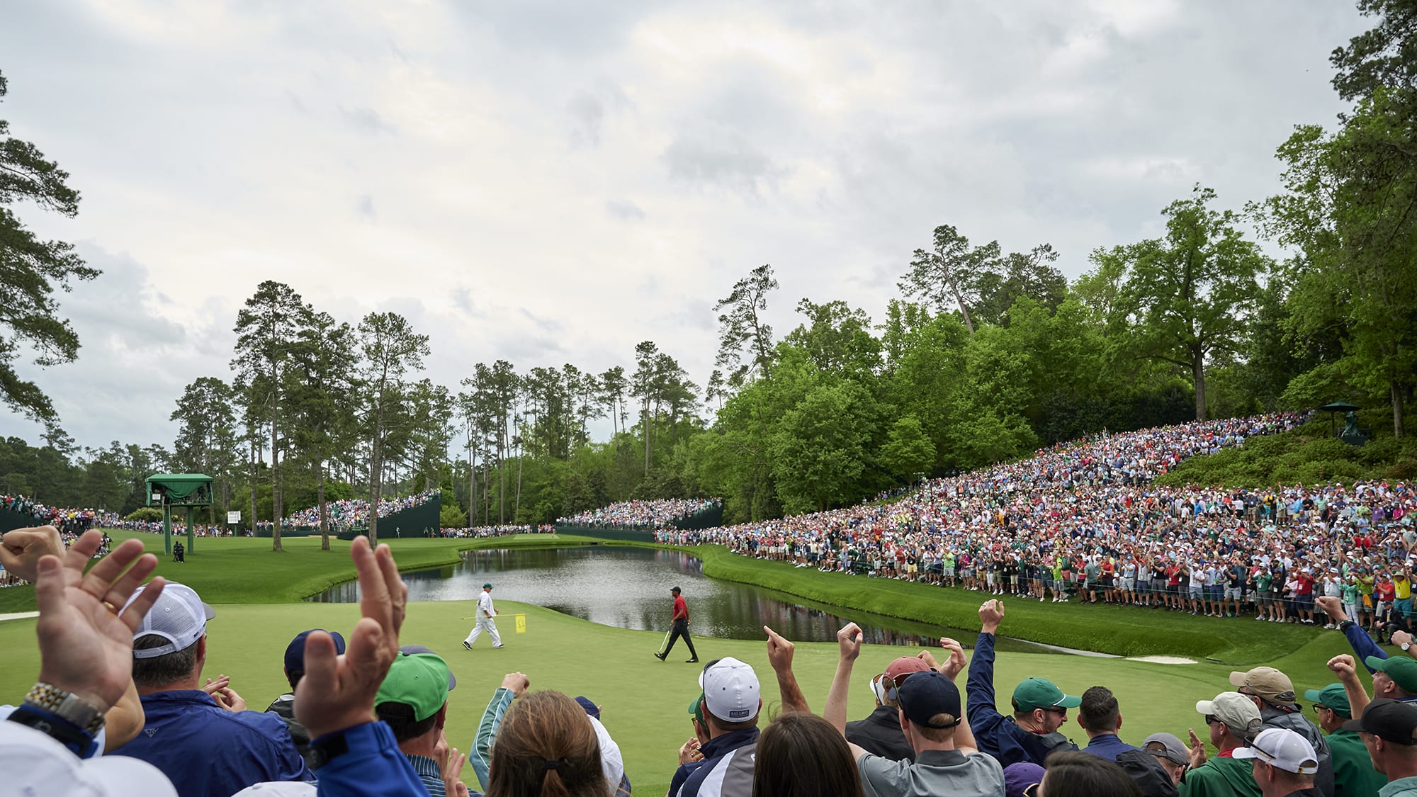 Tiger Woods is on the 16th green at the 2019 Masters.