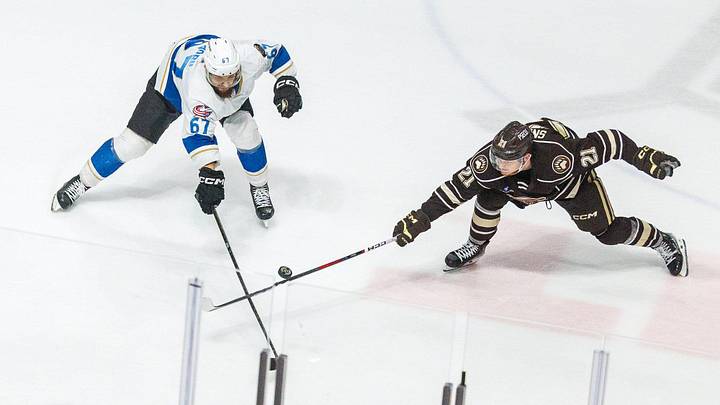 Hershey Bears' Joe Snively (21) competes for the puck against Cleveland Monsters' Jakub Zboril (67) during the decisive game 7 of the AHL Eastern Conference Finals between the Hershey Bears and Cleveland Monsters on Wednesday, June 12, 2024, at the Giant Center in Hershey. The Bears won, 3-2, in overtime.