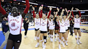 Louisville Volleyball players celebrate