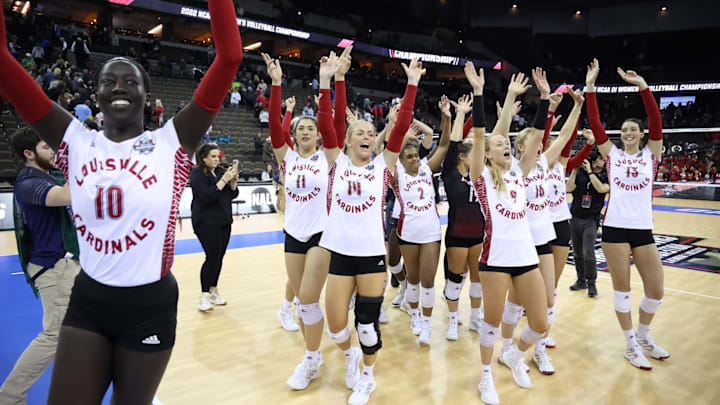 Louisville Volleyball players celebrate