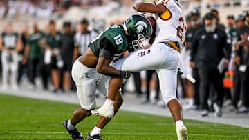 Michigan State's Armorion Smith, left, tackles Central Michigan's DeAnthony Becton during the second quarter on Friday, Sept. 1, 2023, at Spartan Stadium in East Lansing.