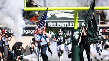 East Lansing first responders run onto the field with the Spartans before Michigan State's football game against Youngstown State on Saturday, Sept. 11, 2021, in East Lansing.

210911 Msu Youngstown Fb 088a