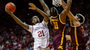 Indiana's Mackenzie Mgbako (21) shoots past Minnesota's Femi Odukale (11) during the Indiana versus Minnesota men's basketball game at Simon Skjodt Assembly Hall on Monday, Dec. 9, 2024.