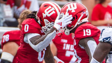 Indiana's Andison Coby (0) celebrates Miles Cross (19) during the first half of the Indiana versus Florida International football game at Memorial Stadium on Saturday, Aug. 31, 2024.