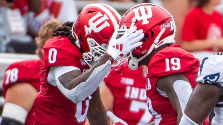 Indiana's Andison Coby (0) celebrates Miles Cross (19) during the first half of the Indiana versus Florida International football game at Memorial Stadium on Saturday, Aug. 31, 2024.