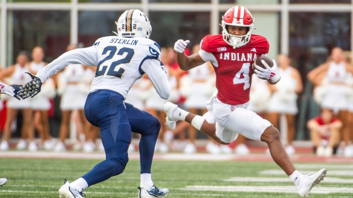 Indiana's Myles Price (4) runs after the catch during the first half of the Indiana versus Florida International football game at Memorial Stadium on Saturday, Aug. 31, 2024.