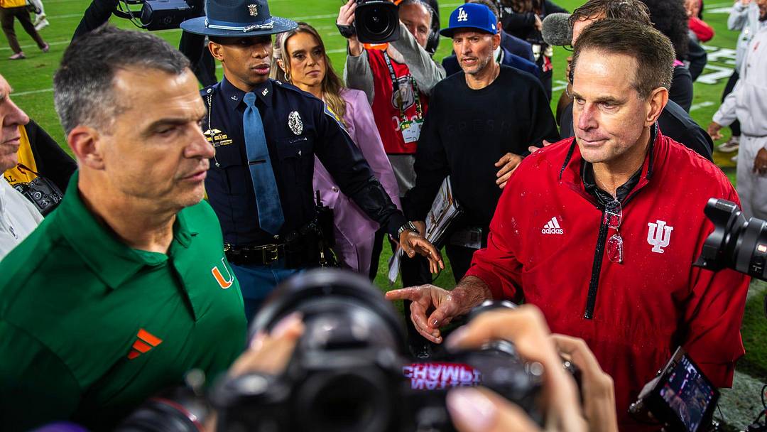 Indiana Head Coach Curt Cignetti and Miami Head Coach Mario Cristobal shake hands after the College Football Playoff National Championship college football game at Hard Rock Stadium in Miami Gardens on Monday, Jan. 19, 2026.