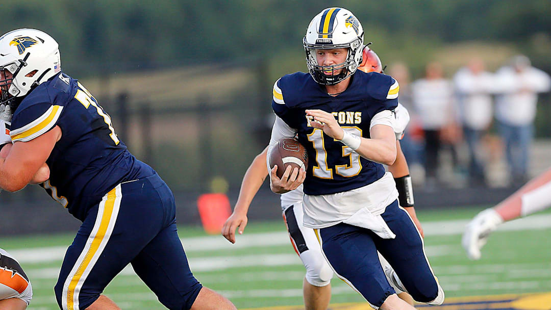 Hillsdale High School's Kael Lewis (13) carries the ball against Lucas High School during high school football action Friday, Aug. 29, 2025 at Hillsdale High School. TOM E. PUSKAR/MANSFIELD NEWS JOURNAL