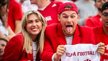 Indiana fans show off the towels placed in every seat before the start of the Indiana versus Michigan football game at Memorial Stadium on Friday, Nov. 9, 2024.