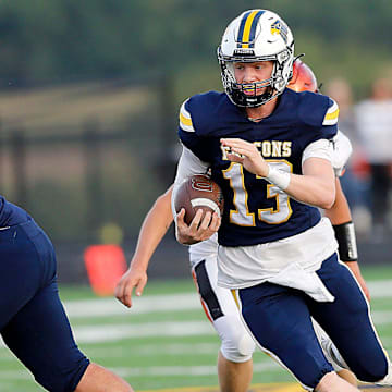 Hillsdale High School's Kael Lewis (13) carries the ball against Lucas High School during high school football action Friday, Aug. 29, 2025 at Hillsdale High School. TOM E. PUSKAR/MANSFIELD NEWS JOURNAL