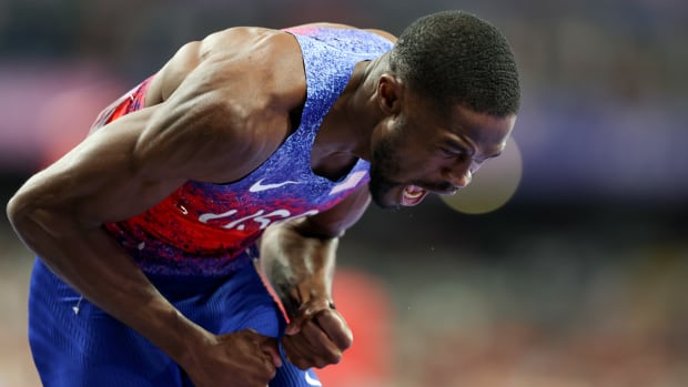 Rai Benjamin exclaims after winning gold in the 400-meter hurdles at the Paris Olympics.