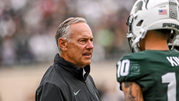 Michigan State's associate head coach Mark Dantonio, left, talks with Noah Kim before the game against Washington on Saturday, Sept. 16, 2023, at Spartan Stadium in East Lansing.
