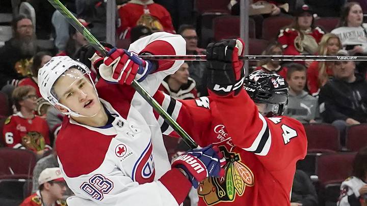 Oct 11, 2025; Chicago, Illinois, USA; Chicago Blackhawks defenseman Wyatt Kaiser (44) checks Montréal Canadiens right wing Ivan Demidov (93) during the second period at United Center. Mandatory Credit: David Banks-Imagn Images