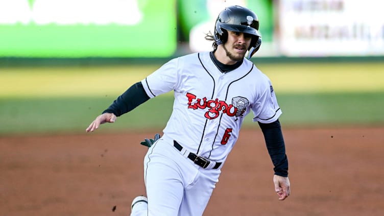 Lugnuts' Austin Beck scores off a hit by Brayan Buelvas in the second inning on Wednesday, April 6,