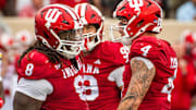Indiana's Aiden Fisher (4) and CJ West (8) celebrate West's sack of Maryland's Billy Edwards Jr. (9) during the Indiana versus Maryland football game at Memorial Stadium on Saturday, Sept. 28, 2024.