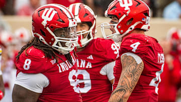Indiana's Aiden Fisher (4) and CJ West (8) celebrate West's sack of Maryland's Billy Edwards Jr. (9) during the Indiana versus Maryland football game at Memorial Stadium on Saturday, Sept. 28, 2024.