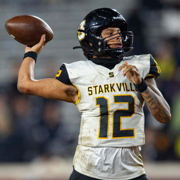 Starkville Yellowjackets' quarterback Billy Petty (12) gears up to pass the ball during the MHSAA 7A football state title game at Vaught-Hemingway Stadium in Oxford, Miss., on Dec. 2, 2023.
