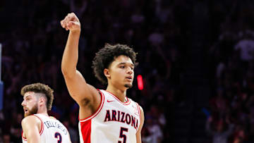 Nov 7, 2025; Tucson, Arizona, USA; Arizona Wildcats guard Brayden Burries (5) holds up his arm after he makes a three pointer during the second half of the game against the Utah Tech Trailblazers at McKale Memorial Center. Mandatory Credit: Aryanna Frank-Imagn Images