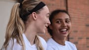 Connecticut sophomore Paige Bueckers, left, shares a laugh with freshman Azzi Fudd at a news conference on Tuesday, Oct. 19, 2021.