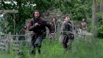 Jamie (Aaron Taylor-Johnson) and his son Spike (Alfie Williams) in Columbia Pictures' 28 YEARS LATER.