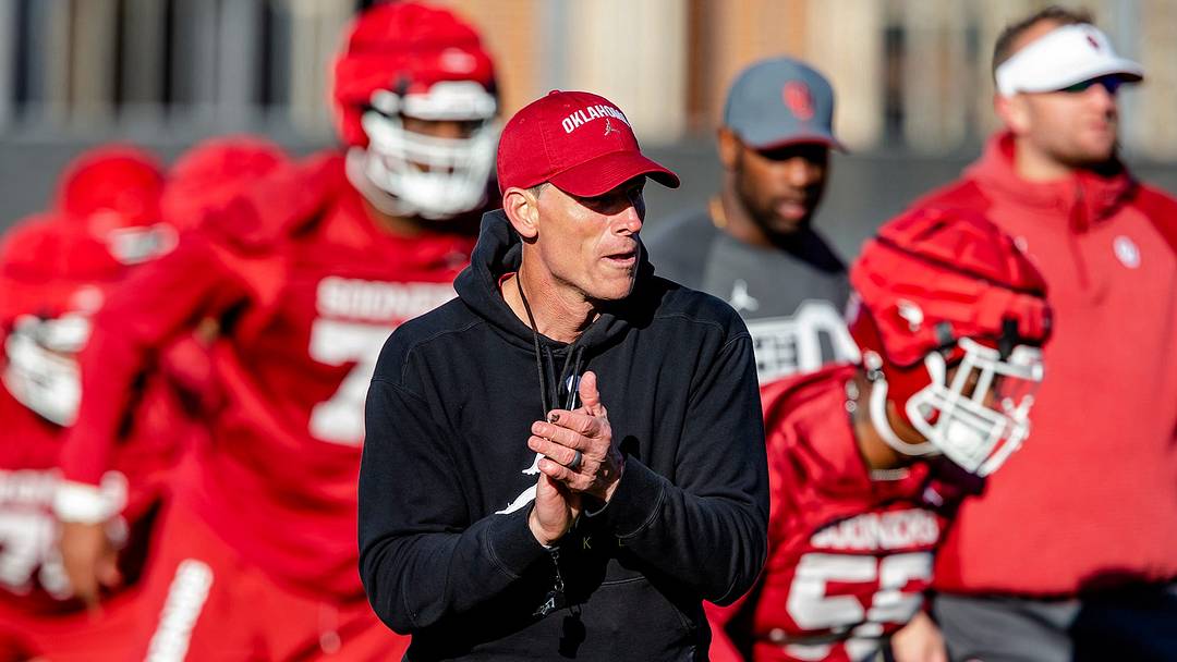 OU football coach Brent Venables works with his team during Thursday's practice in Norman.