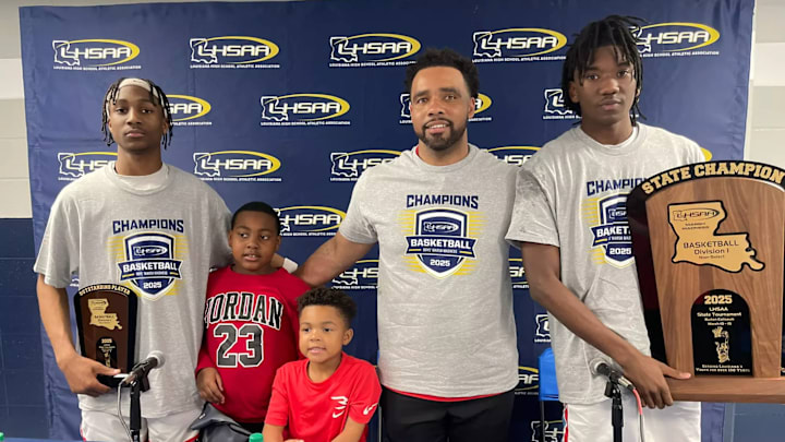 Ian Edmond (far left) and Kristion Brooks (right) with coach Jon McClinton 