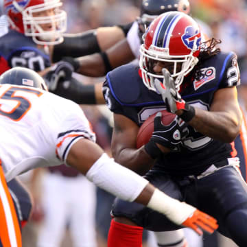 Aug 15, 2009; Orchard Park, NY, USA;  Buffalo Bills running back Marshawn Lynch (23) is tackled by Chicago Bears linebacker Lance Briggs (55) in the 1st quarter at Ralph Wilson stadium. Mandatory Credit: Kevin Hoffman-USA TODAY Sports
