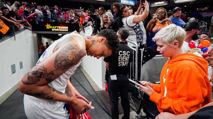 The Phoenix Mercury's Brittney Griner (42) signs autographs after a game between the Indiana Fever and Phoenix Mercury, on Sunday, June 11, 2023, at Gainbridge Fieldhouse in Indianapolis.