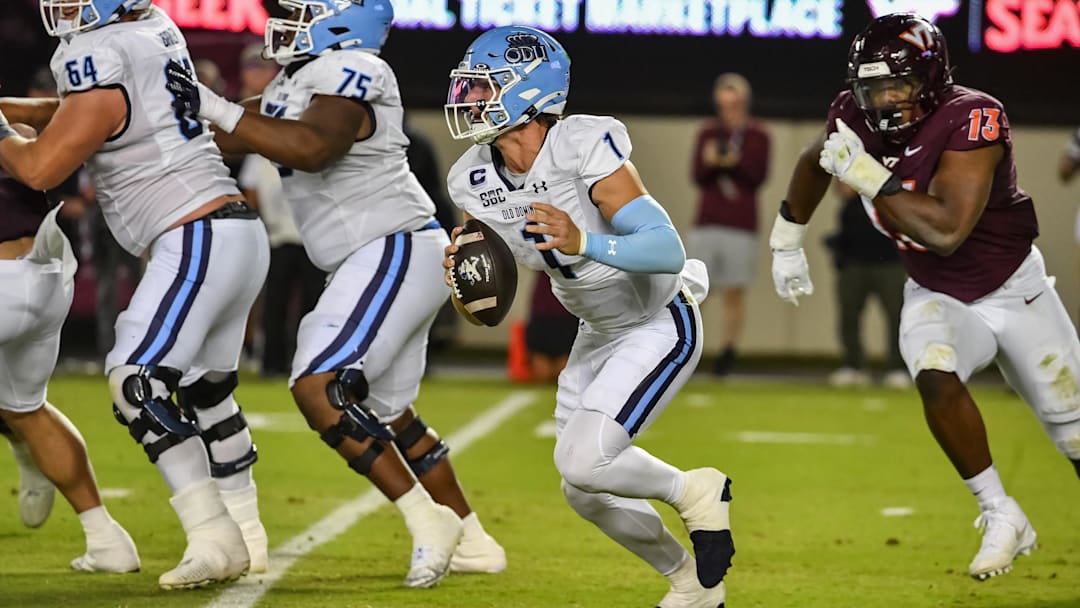 Sep 13, 2025; Blacksburg, Virginia, USA;  Old Dominion Monarchs quarterback Colton Joseph (1) looks to pass during the second quarter Lane Stadium. Mandatory Credit: Brian Bishop-Imagn Images