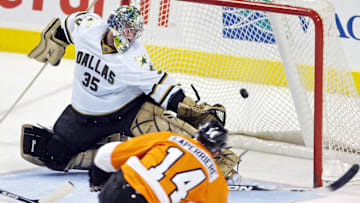 January 12, 2010; Philadelphia, PA USA;  Philadelphia Flyers right wing Ian Laperriere (14) beats Dallas Stars goalie Marty Turco (35) during 2nd period of game at the Wachovia Center in Philadelphia.