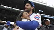 Chicago Cubs shortstop Dansby Swanson hugs his wife, Chicago Stars forward Mallory Swanson, on opening day at Wrigley Field on March 30, 2023, in Chicago.