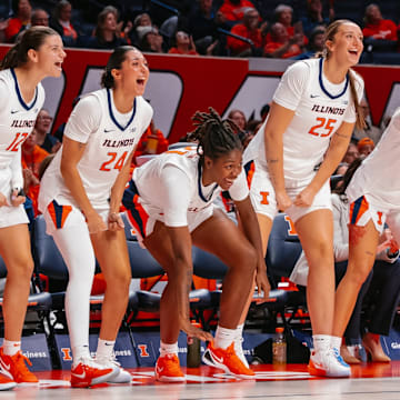 Members of the Illinois women's basketball team cheer on their teammates in the Illini's 76-65 win over Illinois State on Sunday at the State Farm Center in Champaign, Illinois.