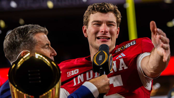 Indiana's Fernando Mendoza (15) talks to the crowd on the podium after the College Football Playoff National Championship college football game at Hard Rock Stadium in Miami Gardens on Monday, Jan. 19, 2026.